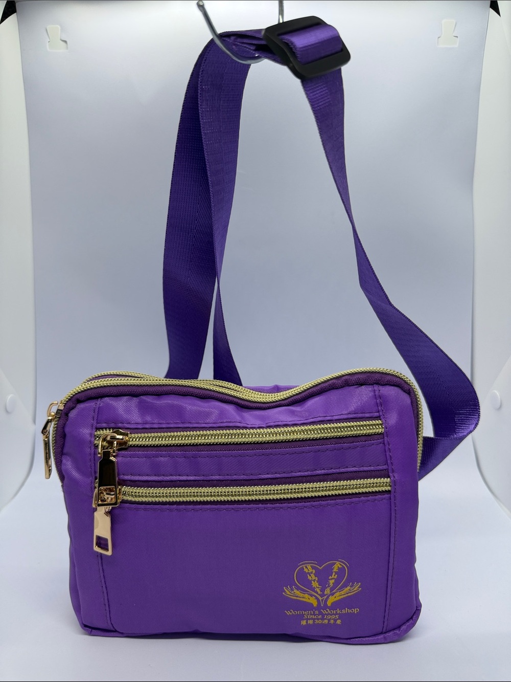 Purple Crossbody Bag with Gold Zippers and Adjustable Strap